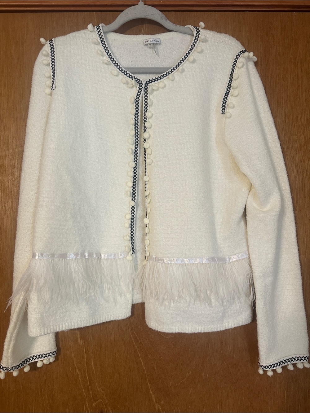 Sioni Cream Bouclé Cardigan with Black Trim & Feather Hem
